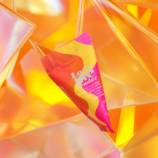 BERLINGOTS LOVE ME TENDER-MASSAGE OIL-COTTON CANDY 10ML/0.33FL.OZ. on colorful background, perfect for intimacy and pleasure.