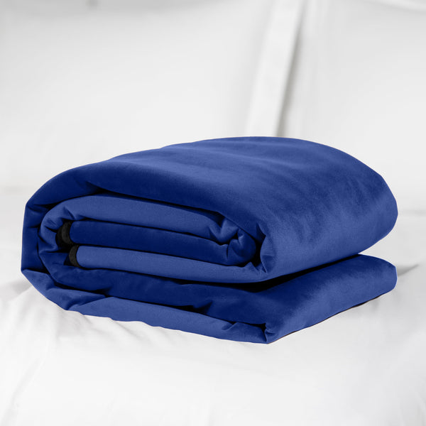 Fascinator Throw Royal Blue Microvelvet - Regular Size on bed