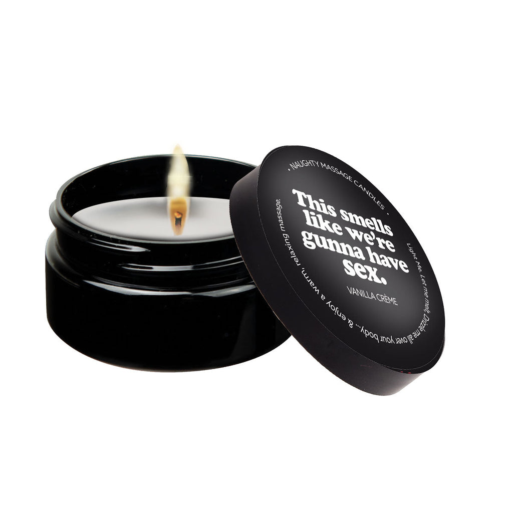 This Smells Like We're Gunna Have Sex - Naughty Mini Massage Candle in a black container with a lit wick.