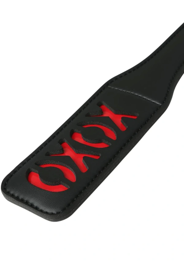 XOXO Paddle: Black - Black vinyl paddle with red XOXO design, perfect for couples sex toys and intimate wellness.