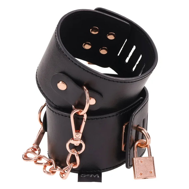 Brat Locking Cuffs in black vegan leather with rose gold accents, perfect for couples. Buy sex toys online Idaho.